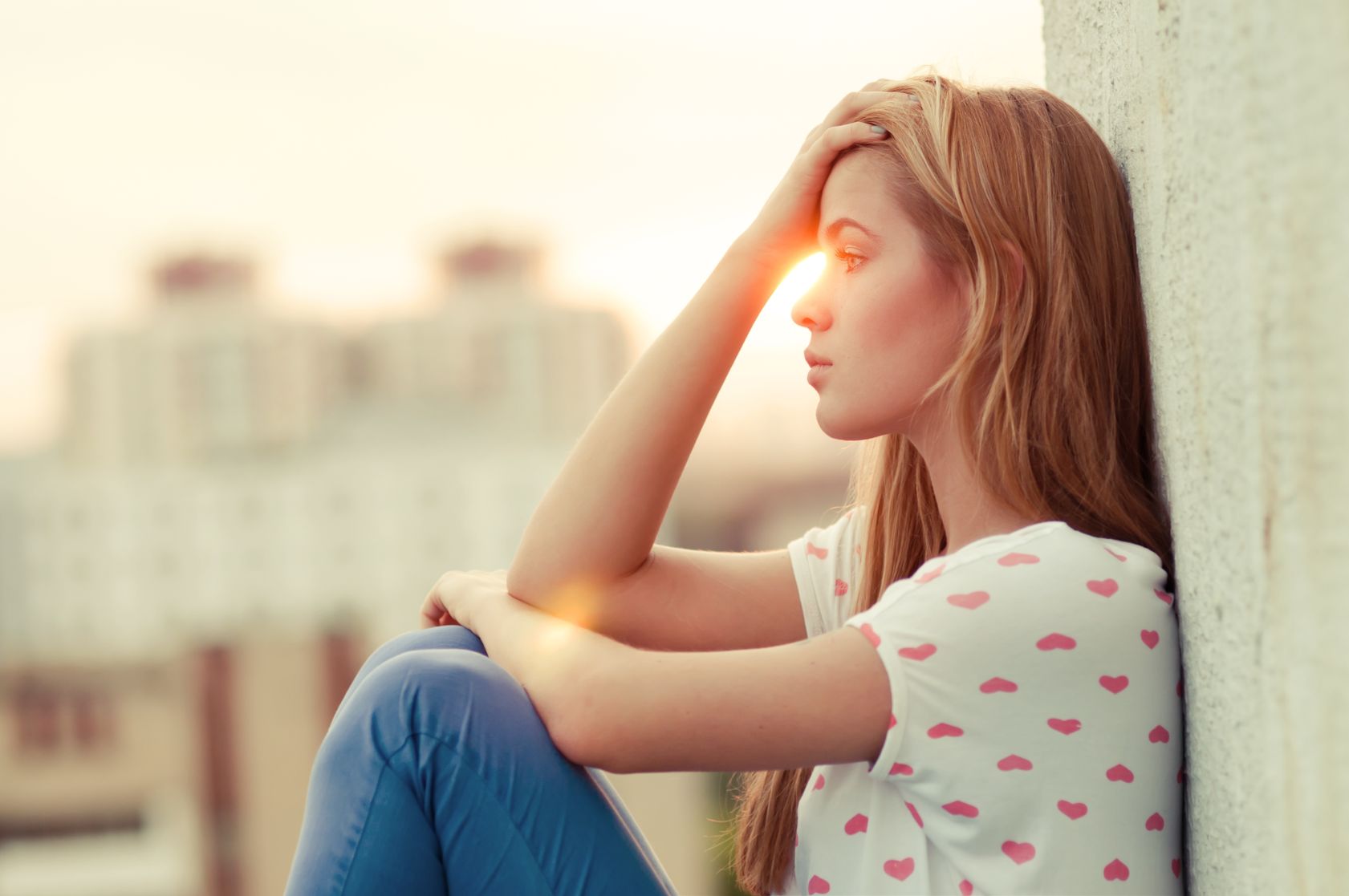 Sad teenage girl - risk factors for suicide