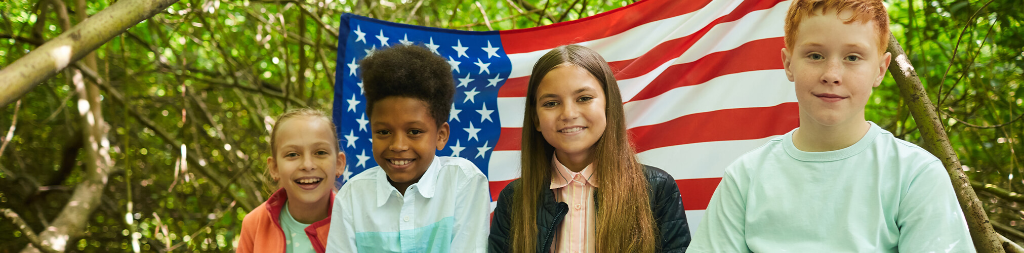 Children in front of American flag