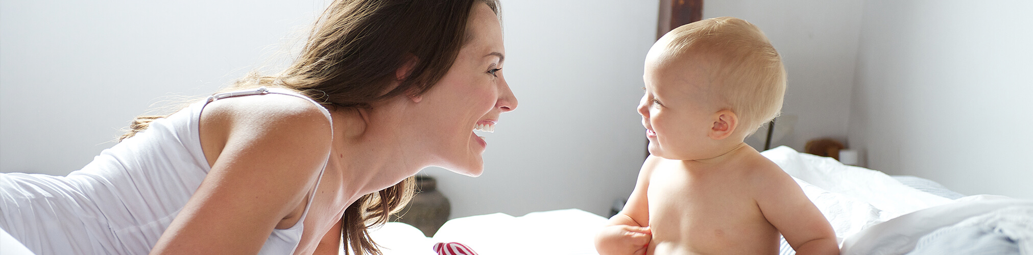 Mother and baby smiling - positive parenting